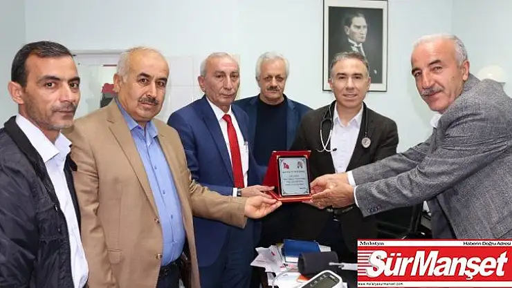 Muhtardan profesöre plaket